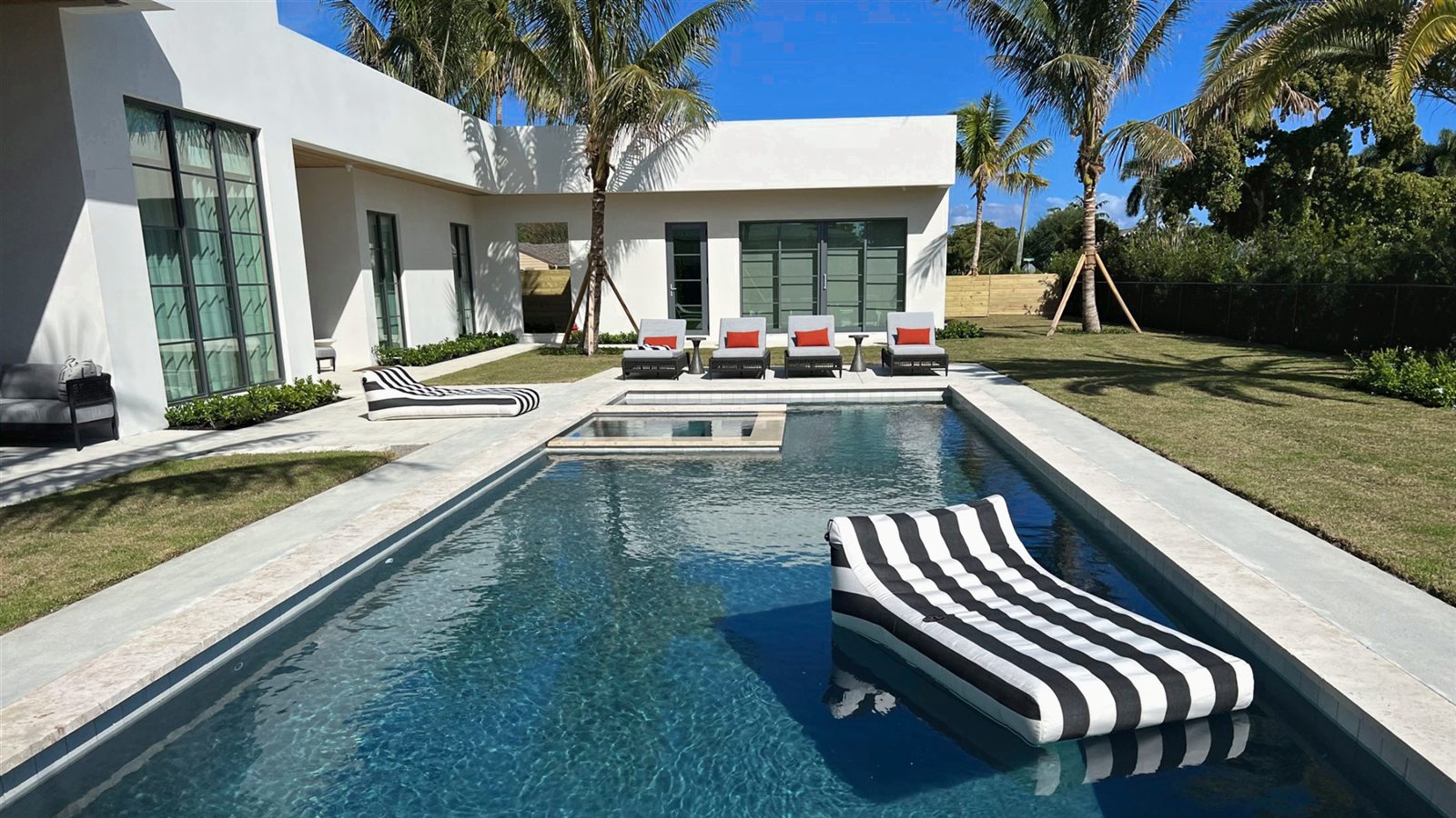 Luxury pool with spa and modern outdoor living area