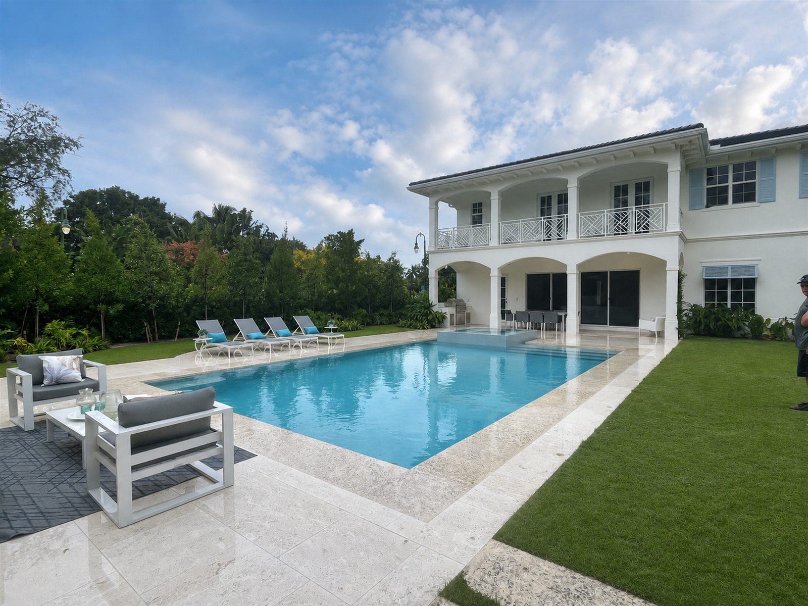 Bright residential pool with decorative deck pattern